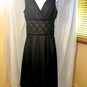 Dress Barn Elegant Black dress with shoulder tie and lace inset at waist. Size 6